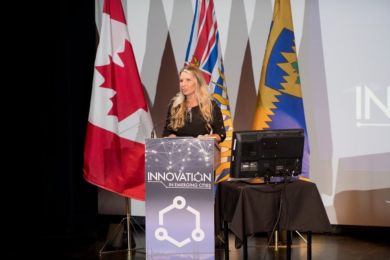 Chelsa Meadus speaking at a podium